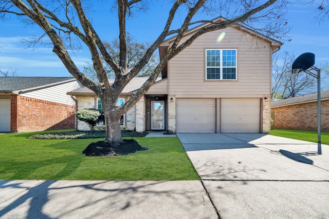 traditional-style home with an attached garage, concrete driveway, and a front yard