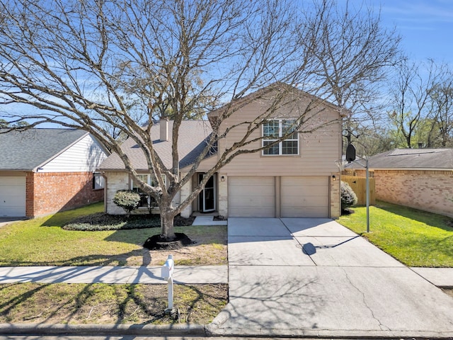 view of front facade featuring a front yard, an attached garage, brick siding, and driveway