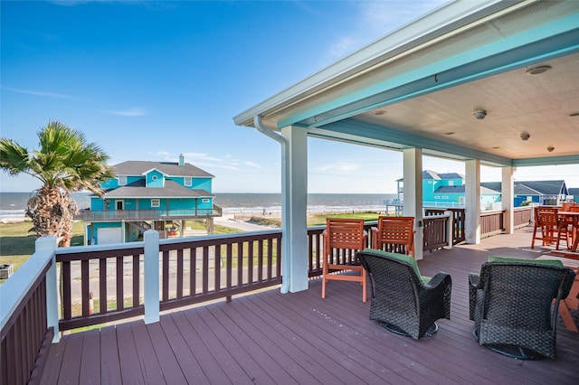 wooden deck featuring a water view