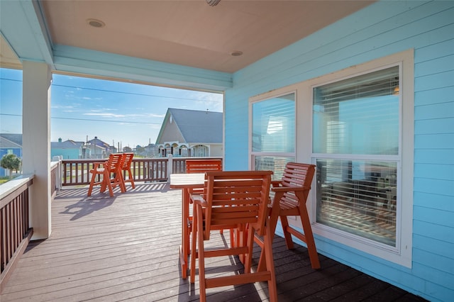 wooden deck featuring a residential view