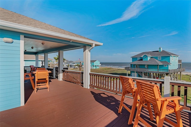 wooden deck with a water view