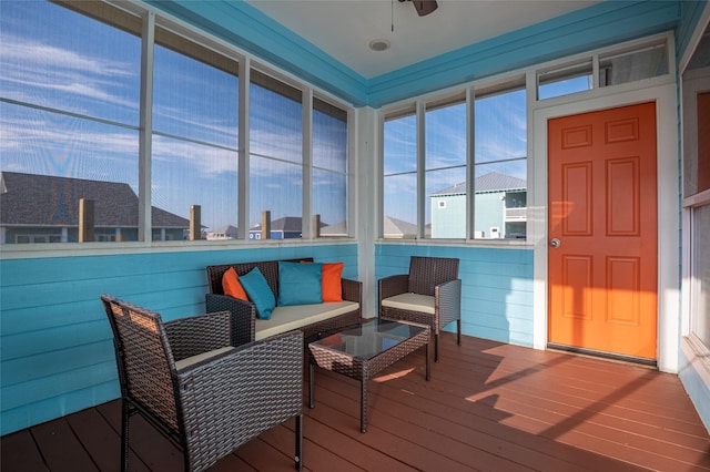 sunroom / solarium with ceiling fan