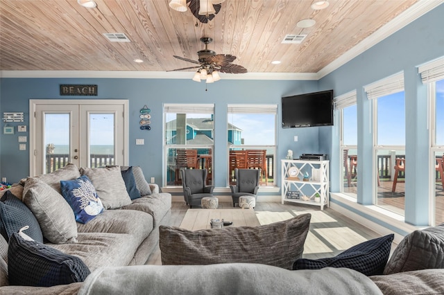 living area with french doors, wood finished floors, wood ceiling, and ornamental molding