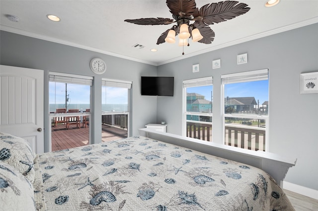 bedroom with visible vents, multiple windows, ornamental molding, and access to outside