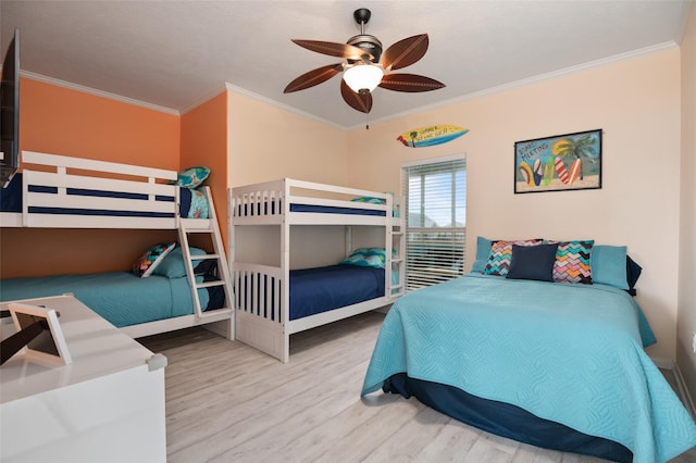 bedroom featuring crown molding, ceiling fan, and wood finished floors