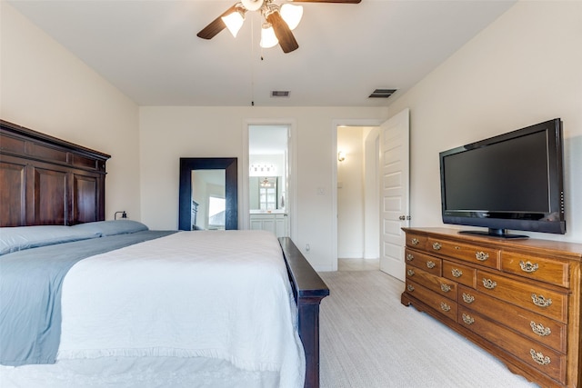 bedroom featuring visible vents, light colored carpet, and ceiling fan