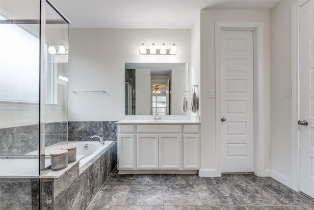 bathroom with a bath, an enclosed shower, and vanity