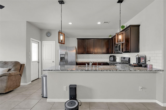 kitchen with visible vents, light stone counters, a sink, appliances with stainless steel finishes, and dark brown cabinets