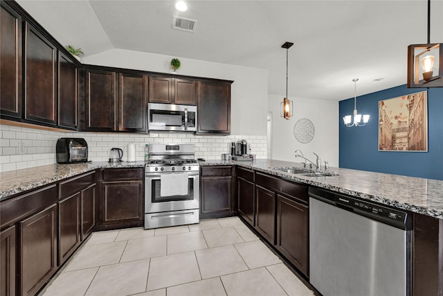 kitchen with visible vents, a sink, stainless steel appliances, a peninsula, and light stone countertops