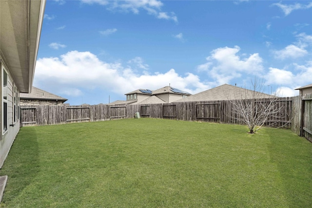 view of yard with a fenced backyard