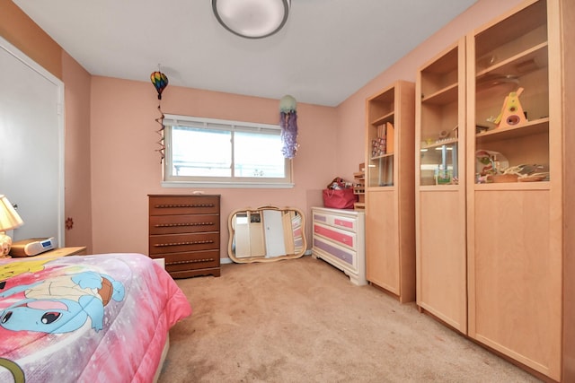 bedroom featuring light colored carpet