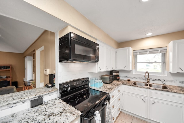 kitchen featuring black appliances, white cabinets, tasteful backsplash, and a sink