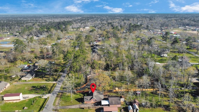 drone / aerial view featuring a view of trees