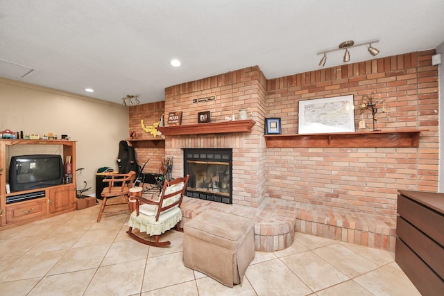 living area featuring tile patterned floors, a brick fireplace, track lighting, and recessed lighting