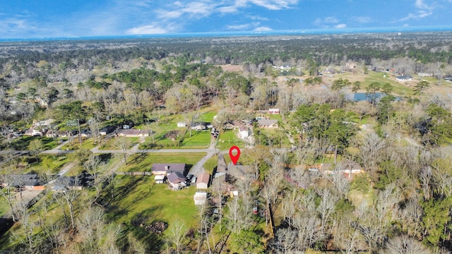 birds eye view of property with a forest view