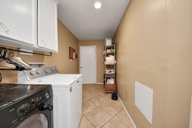 laundry room featuring visible vents, baseboards, light tile patterned floors, washer and dryer, and cabinet space