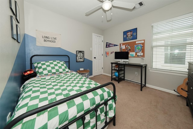 carpeted bedroom with visible vents, ceiling fan, and baseboards