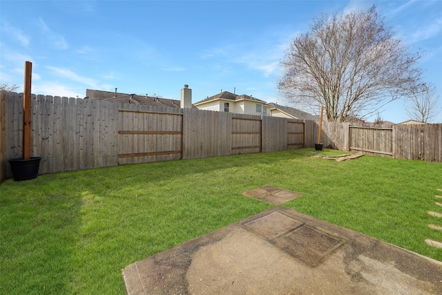 view of yard with a fenced backyard