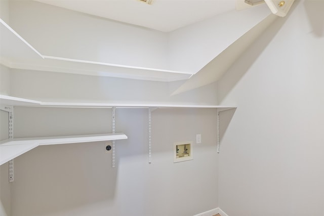 laundry area featuring laundry area, hookup for a washing machine, and hookup for an electric dryer