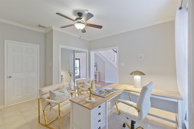 office featuring crown molding, light tile patterned flooring, a ceiling fan, and visible vents