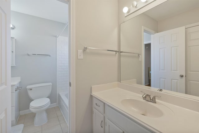 bathroom with vanity, baseboards, tub / shower combination, tile patterned floors, and toilet