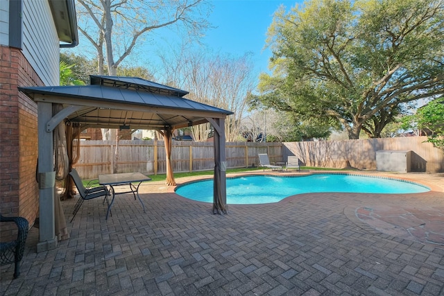 view of pool featuring a gazebo, a fenced in pool, a patio, and a fenced backyard