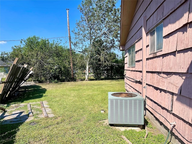 view of yard featuring central air condition unit