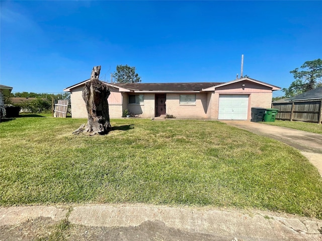 ranch-style house featuring a front yard, an attached garage, driveway, and fence