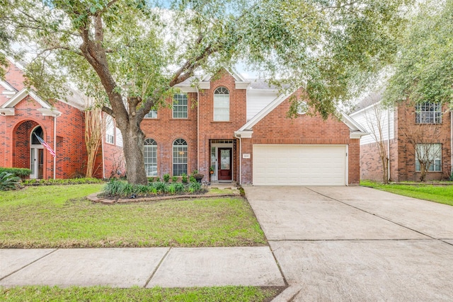 traditional home with a garage, driveway, brick siding, and a front yard