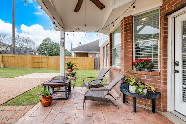 view of patio featuring ceiling fan and a fenced backyard