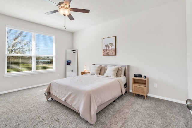 bedroom featuring baseboards, light carpet, and a ceiling fan