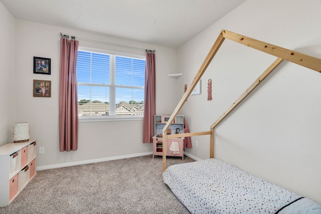 bedroom featuring baseboards and carpet floors