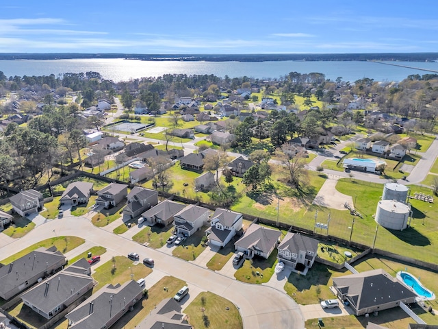 drone / aerial view with a residential view and a water view