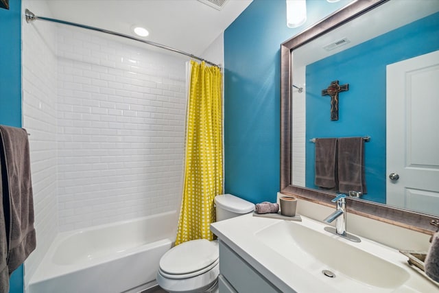 bathroom featuring visible vents, vanity, toilet, and shower / tub combo with curtain