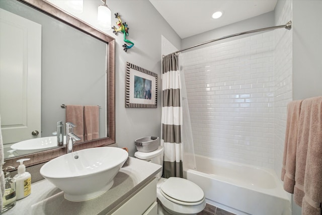 bathroom with shower / bath combination with curtain, vanity, and toilet