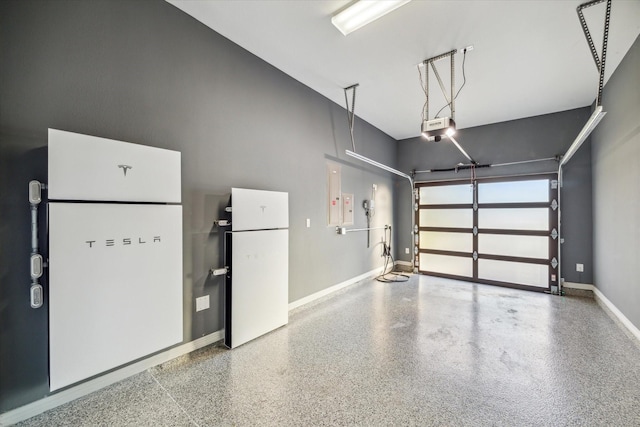 garage featuring baseboards and a garage door opener