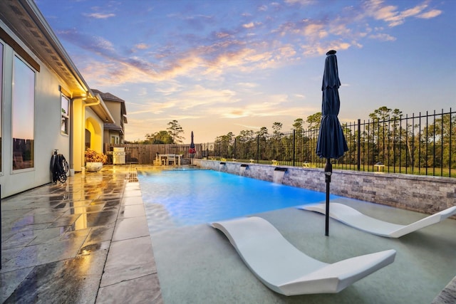 view of pool with a patio area, a fenced in pool, and a fenced backyard