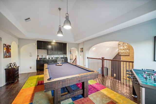 game room with arched walkways, visible vents, pool table, and a raised ceiling