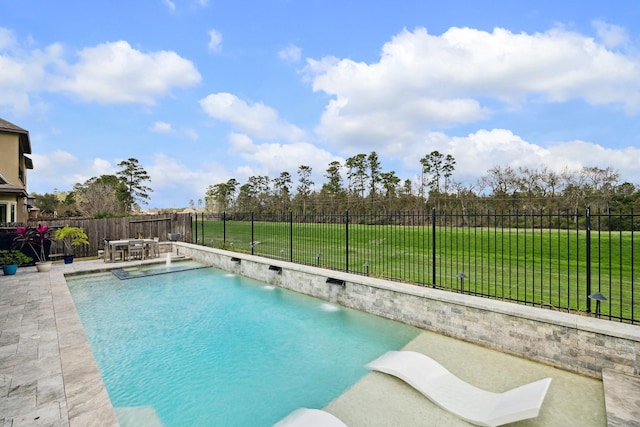 view of swimming pool featuring a yard, a fenced in pool, a fenced backyard, and a patio area