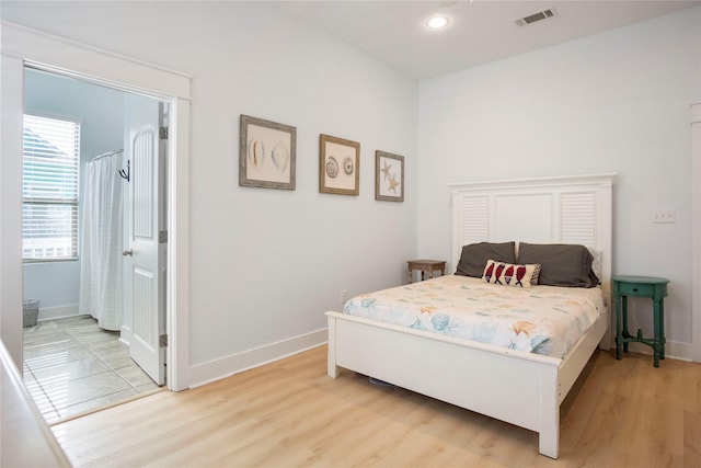 bedroom with recessed lighting, baseboards, visible vents, and light wood-type flooring