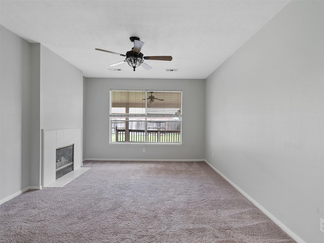 23134 Beech Canyon Dr, Katy, TX 77494 - unfurnished living room with a fireplace, carpet floors, ceiling fan, and baseboards