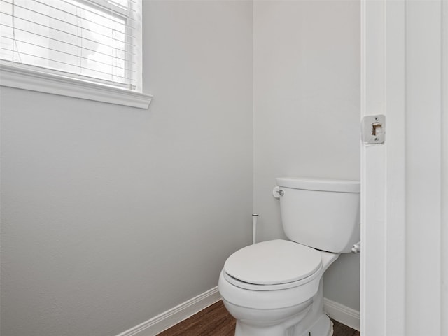 23134 Beech Canyon Dr, Katy, TX 77494 - bathroom with baseboards, wood finished floors, and toilet