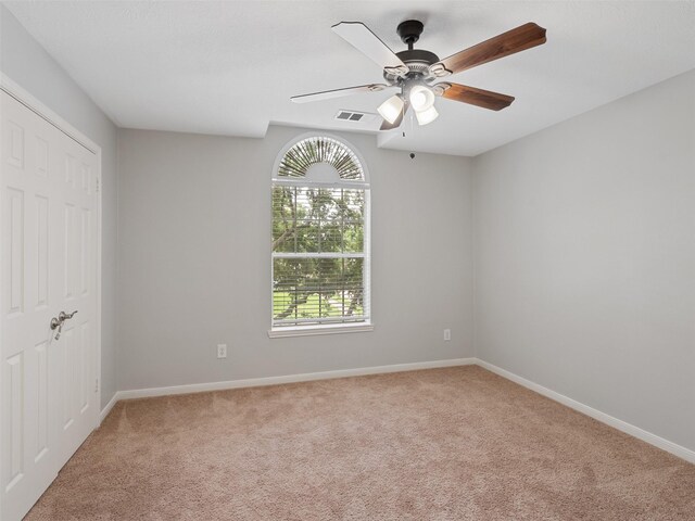 23134 Beech Canyon Dr, Katy, TX 77494 - unfurnished bedroom with light carpet, baseboards, ceiling fan, and a closet