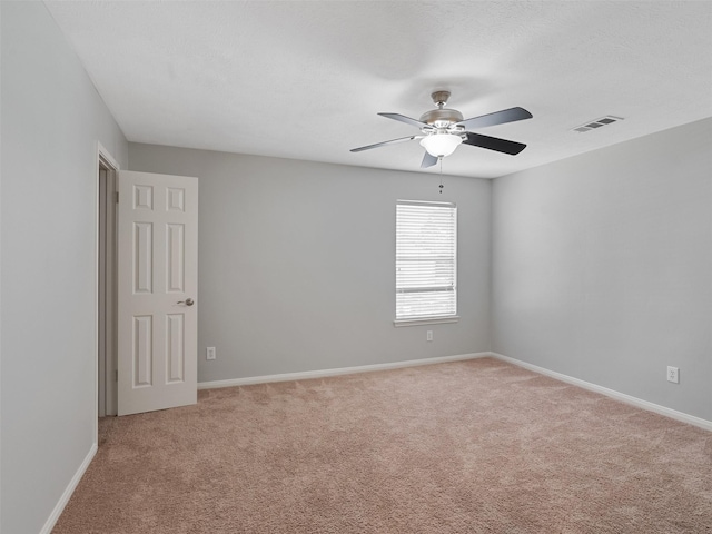 23134 Beech Canyon Dr, Katy, TX 77494 - spare room with light colored carpet, ceiling fan, and baseboards
