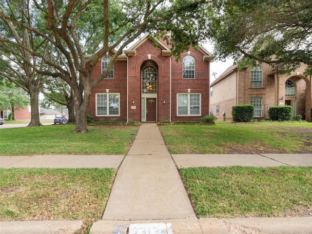 23134 Beech Canyon Dr, Katy, TX 77494 - traditional-style home with a front lawn and brick siding