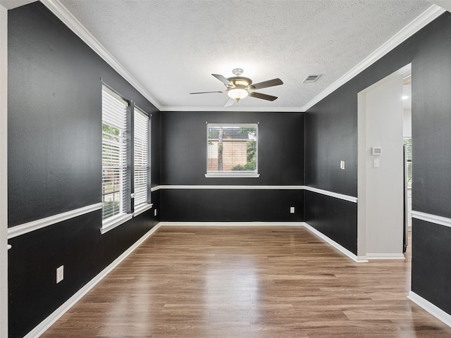 23134 Beech Canyon Dr, Katy, TX 77494 - unfurnished room featuring wood finished floors, ceiling fan, ornamental molding, baseboards, and a textured ceiling