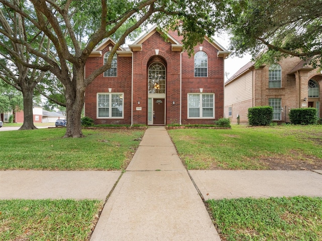 23134 Beech Canyon Dr, Katy, TX 77494 - traditional-style home with a front yard and brick siding