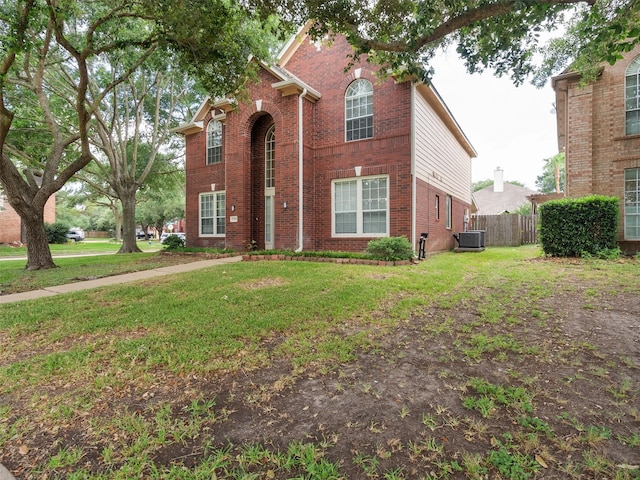 23134 Beech Canyon Dr, Katy, TX 77494 - traditional-style house with brick siding and central AC unit