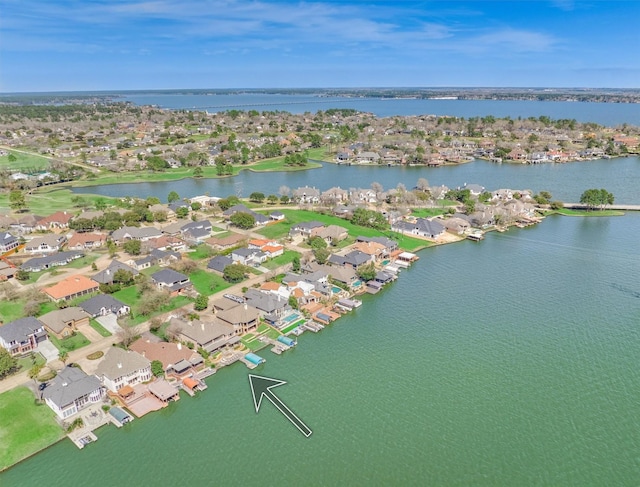 birds eye view of property with a residential view and a water view