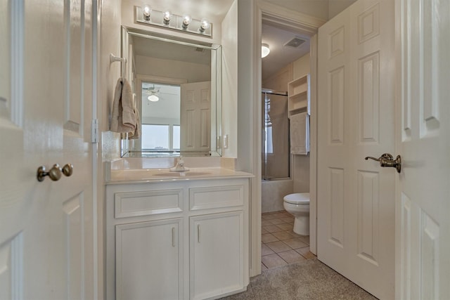 84 Waterford Way, Montgomery, TX 77356 - bathroom with toilet, vanity, combined bath / shower with glass door, and tile patterned floors